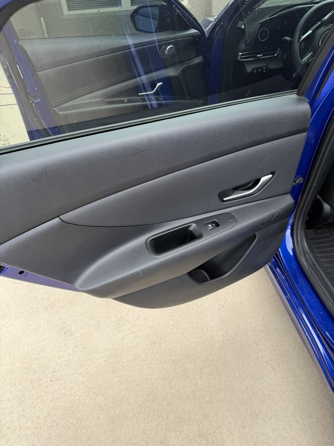 Detailed Hyundai Elantra interior door panel with clean controls and trim