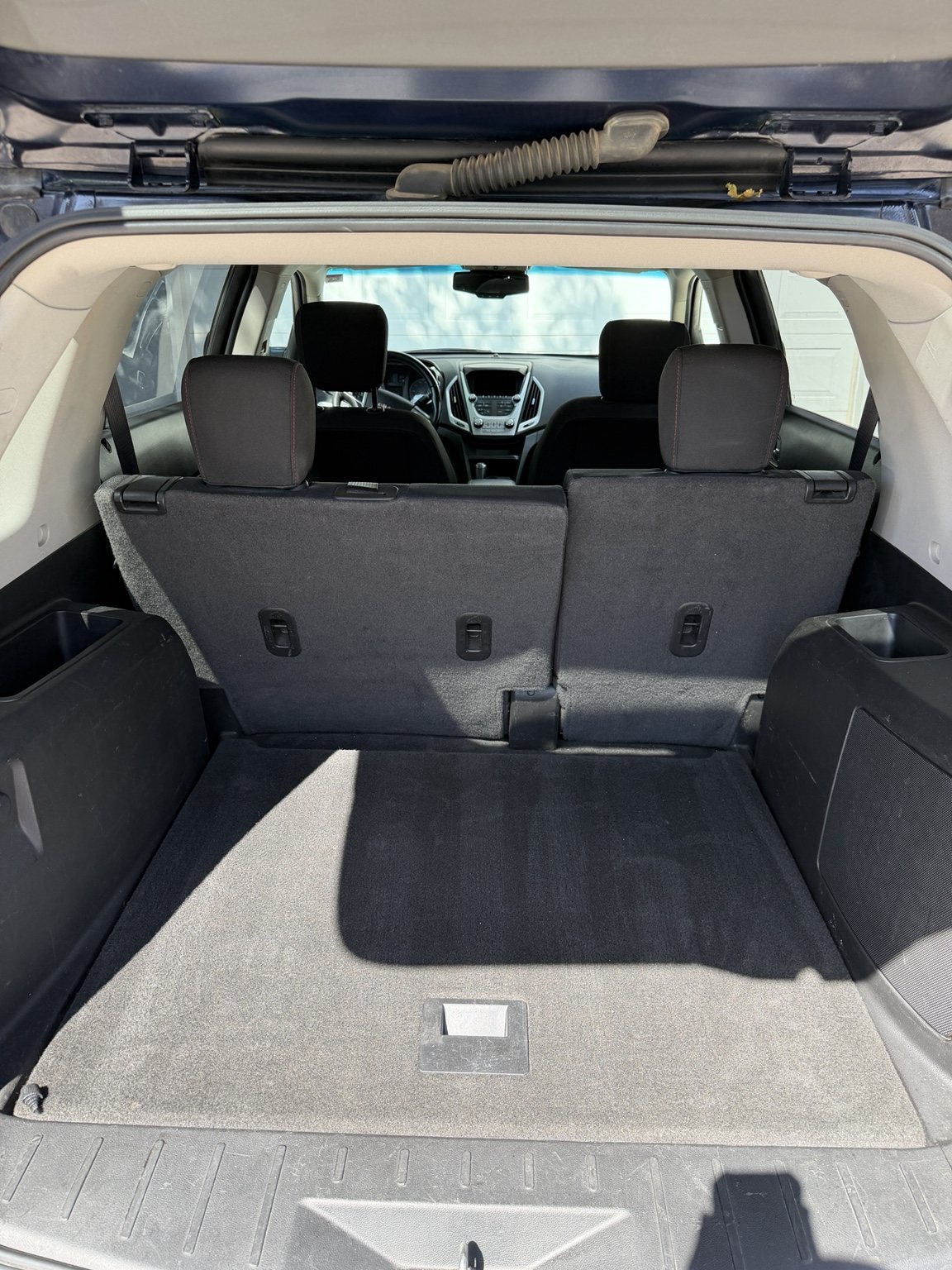 Clean GMC Terrain cargo area with detailed carpet, trim, and seatbacks