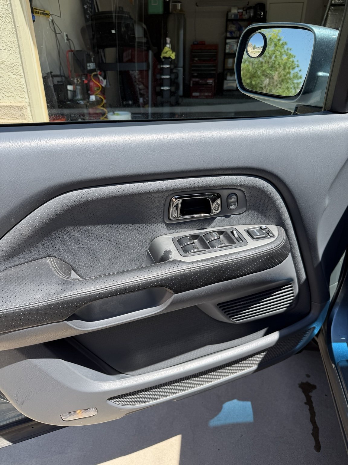 Clean Honda interior door panel with restored trim and storage pocket