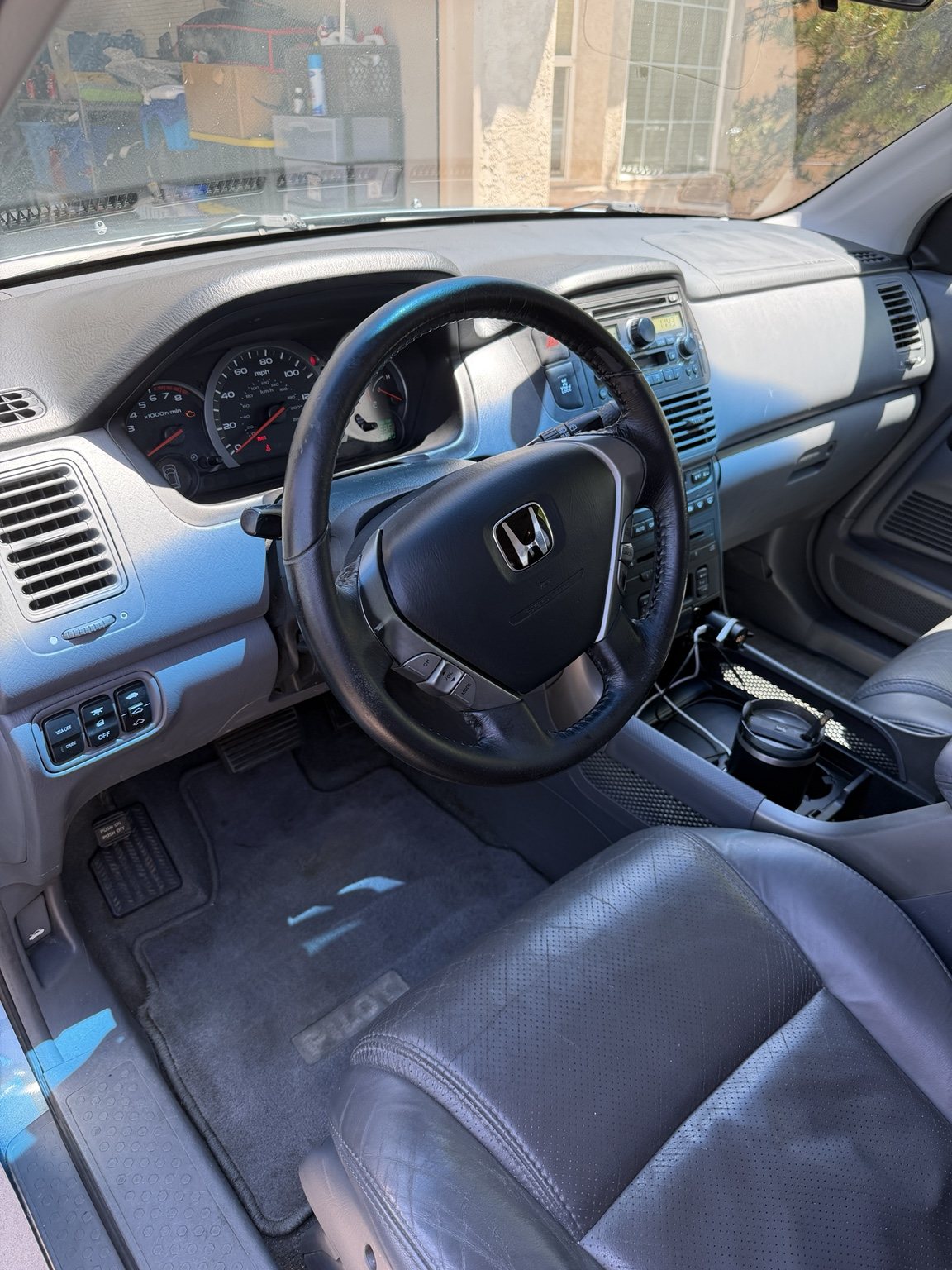 Restored Honda front cabin with cleaned seats, dashboard, console, and carpets