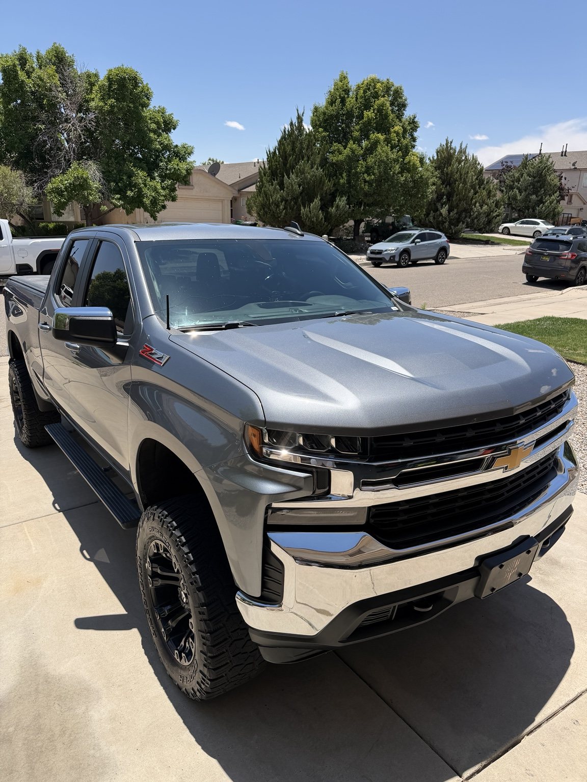 Silver Chevrolet Silverado shown from the front after complete exterior detailing